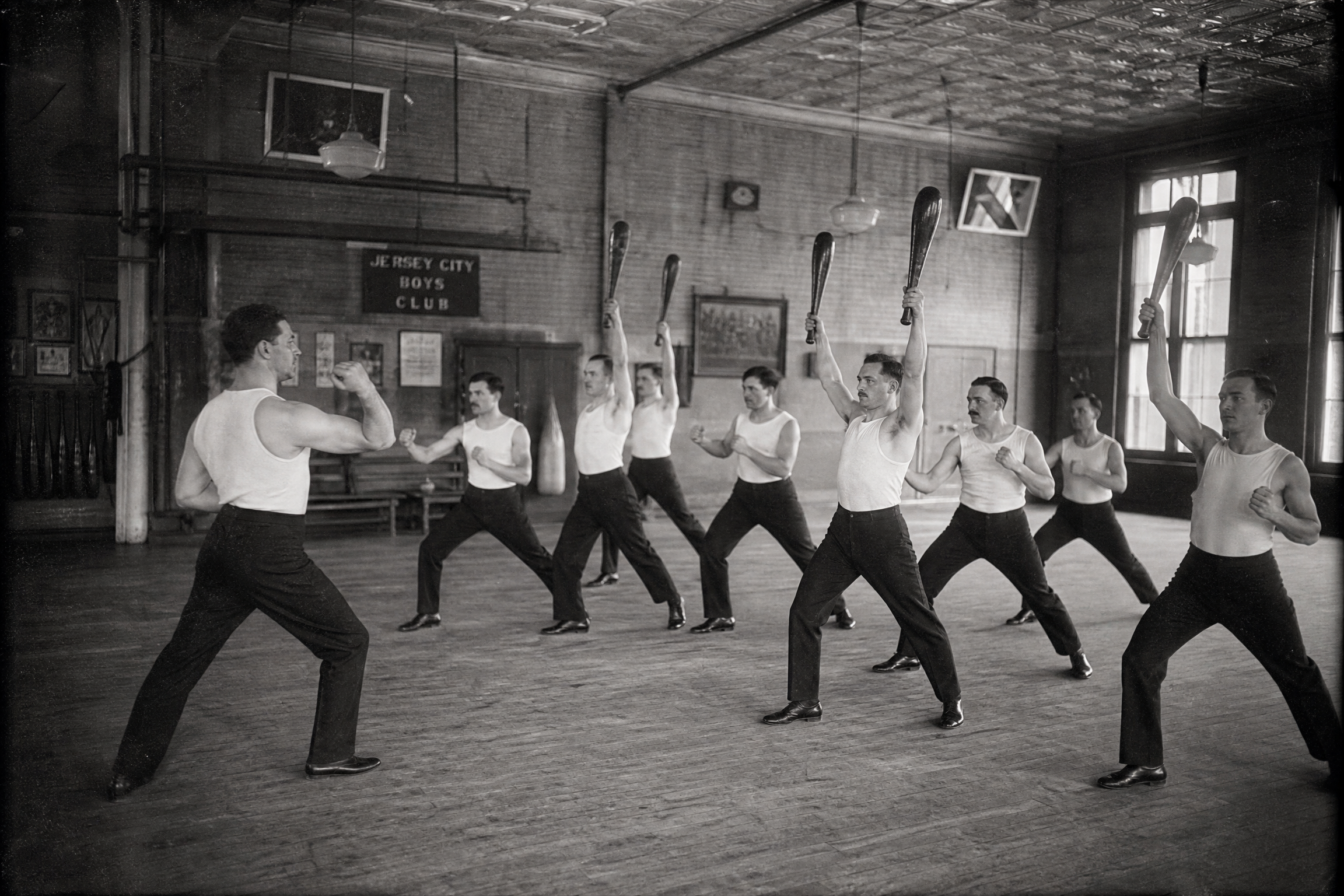Men training in classical gymnasium formation